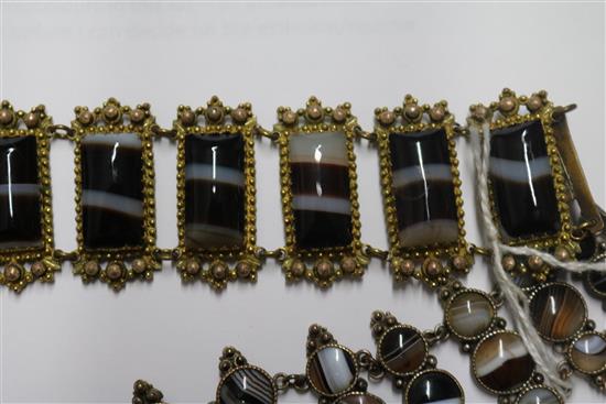 Two banded agate bracelets, one in gilt metal, one in white metal.